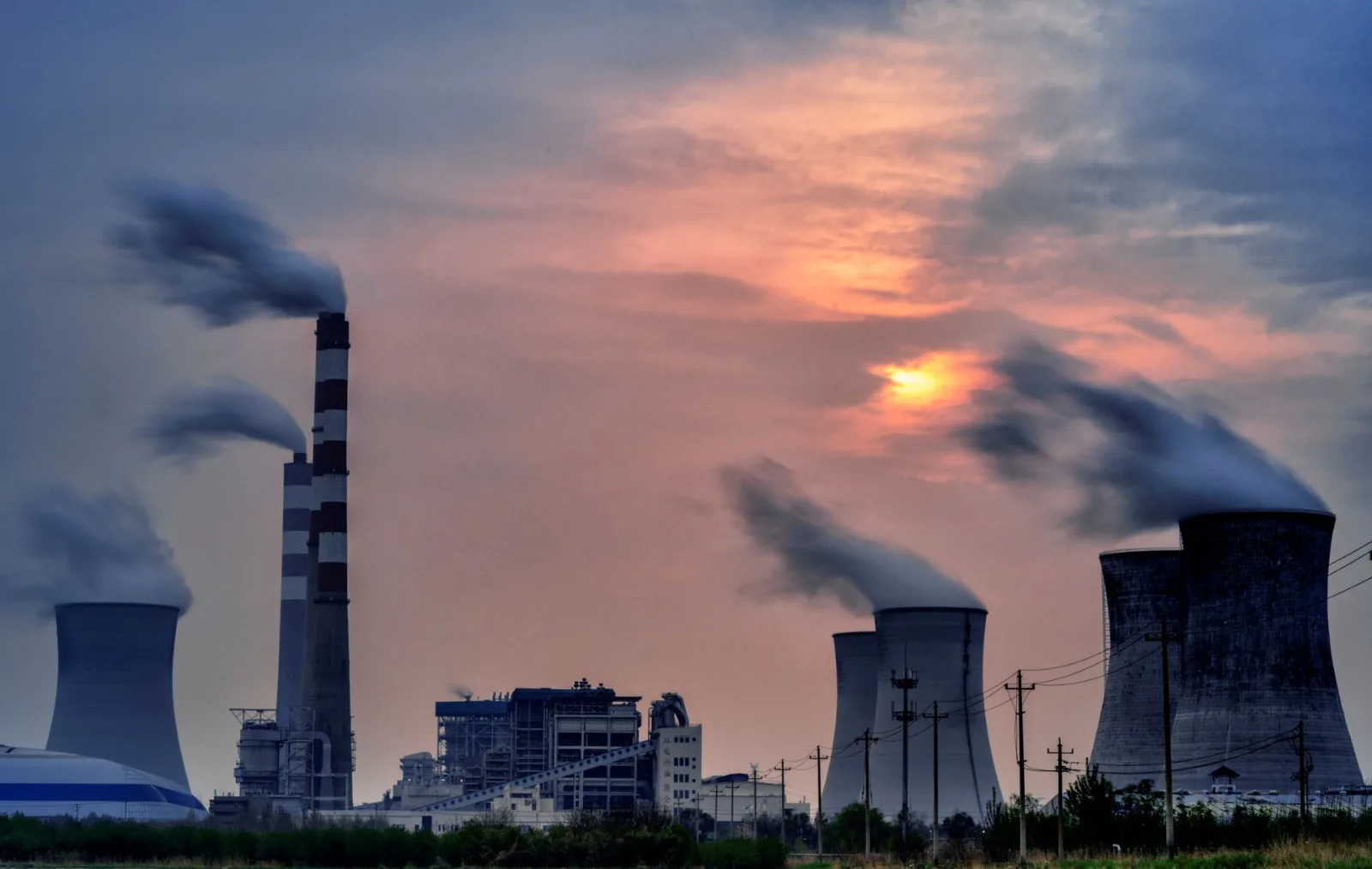 China's Wind and Solar Boom Hampered by Coal Contracts and Grid Limits, Raising Emissions